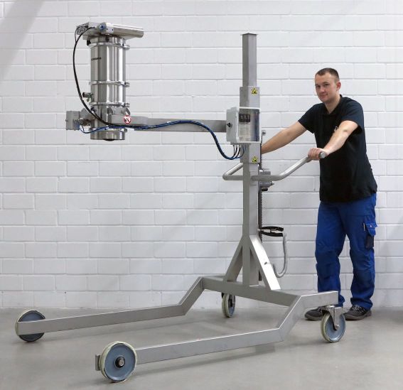 Volkmann vacuum conveyor trolley on wheels with worker